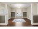 Spacious living room with hardwood floors, built-in shelves, neutral colors, and a decorative rug offers a stylish, comfortable space at 222 E Main St, Moncks Corner, SC 29461