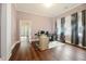 Office with hardwood floors, natural light, and an adjacent room connected by a large doorway at 222 E Main St, Moncks Corner, SC 29461