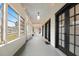 Charming enclosed porch featuring great natural light and ample seating at 222 E Main St, Moncks Corner, SC 29461