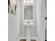 Elegant half bath showcasing pedestal sink, decorative mirror and stylish fixtures at 232 O'Malley Dr, Summerville, SC 29483