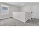 Upstairs bonus room features plush carpet and a large window providing natural light at 232 O'Malley Dr, Summerville, SC 29483