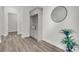 Hallway with wood floors, a built-in storage bench, and a decorative mirror at 232 O'Malley Dr, Summerville, SC 29483