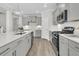 Modern kitchen featuring stainless steel appliances, quartz countertops, and gray cabinetry at 232 O'Malley Dr, Summerville, SC 29483