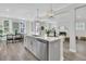 Open kitchen with stainless appliances, dishwasher, quartz countertops, and natural lighting at 232 O'Malley Dr, Summerville, SC 29483