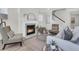 Comfortable living room with a fireplace, stylish decor, and an open staircase at 232 O'Malley Dr, Summerville, SC 29483