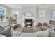 Cozy living room with fireplace, neutral furniture, and ample natural light at 232 O'Malley Dr, Summerville, SC 29483