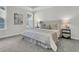 Bright main bedroom featuring a large bed, side tables with lamps, and a sunny window at 232 O'Malley Dr, Summerville, SC 29483