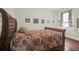 Cozy bedroom with floral bedding, a patterned pillow and light colored walls at 234 Rutledge Ave # D, Charleston, SC 29403