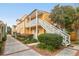 Charming two-story home featuring a staircase, landscaping and a sunny exterior at 234 Rutledge Ave # D, Charleston, SC 29403