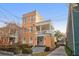 Charming three-story home featuring a welcoming front porch and well-maintained landscaping at 234 Rutledge Ave # D, Charleston, SC 29403