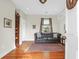 Cozy living room featuring hardwood floors, a comfortable sofa, and natural light at 234 Rutledge Ave # D, Charleston, SC 29403