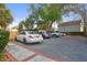 Spacious parking area featuring a gravel driveway and multiple parked cars at 234 Rutledge Ave # D, Charleston, SC 29403
