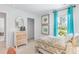 Bright bedroom features a patterned bedspread, serene artwork, and streams natural light at 243 Watersglen Dr, Summerville, SC 29486