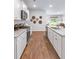 Bright, modern kitchen with stainless steel appliances, granite countertops, and open concept design at 243 Watersglen Dr, Summerville, SC 29486