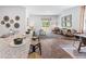 Open concept living area with designer decor, island seating and tons of natural light at 243 Watersglen Dr, Summerville, SC 29486