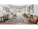 Bright living area with designer decor, lots of natural light and hardwood flooring at 243 Watersglen Dr, Summerville, SC 29486