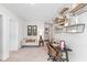 Charming office space featuring a cozy sofa, floating shelving, and great natural light at 243 Watersglen Dr, Summerville, SC 29486