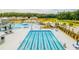 Overhead shot showcasing a large community pool with lap lanes, slides, and plenty of seating for residents at 254 Watersglen Dr, Summerville, SC 29486