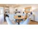 Open-concept kitchen and dining area with a kitchen island, stainless appliances, and hardwood flooring at 254 Watersglen Dr, Summerville, SC 29486