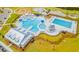 Aerial view of a community pool with a slide, lap lanes, shaded seating, and a recreation area at 254 Watersglen Dr, Summerville, SC 29486