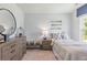 A cozy bedroom decorated with oars and a striped bedspread at 265 Watersglen Dr, Summerville, SC 29486