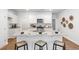 Modern kitchen with a large island, granite countertops, stainless steel appliances, and stylish bar stools at 265 Watersglen Dr, Summerville, SC 29486