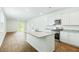 Bright kitchen featuring stainless steel appliances, granite countertops, and an island with a sink at 271 Watersglen Dr, Summerville, SC 29486