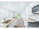 Kitchen featuring stainless steel appliances, granite countertops, island with sink and laminate flooring at 271 Watersglen Dr, Summerville, SC 29486