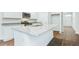 Kitchen featuring stainless steel appliances, granite countertops, island with a sink and laminate flooring at 271 Watersglen Dr, Summerville, SC 29486