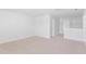 Bright, carpeted bonus room with white trim and a view to the bathroom at 276 Watersglen Dr, Summerville, SC 29486