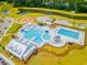 Stunning aerial view of a community pool, lake, and playground at 276 Watersglen Dr, Summerville, SC 29486