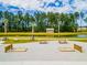 Aerial view of a recreation area with picnic tables, bench seating, lake views, and horseshoe pits at 276 Watersglen Dr, Summerville, SC 29486