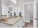 Well-lit bathroom with granite countertops and soft-close doors at 3127 Safe Harbor Way, Charleston, SC 29414