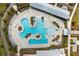 Stunning aerial view of a resort-style pool area with multiple pools, sun loungers, and lush landscaping at 332 Clearpath Dr, Summerville, SC 29486