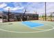 Outdoor community basketball court with a blue key offers recreation and fitness opportunities in a safe and fenced-in area at 332 Clearpath Dr, Summerville, SC 29486
