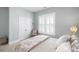 Well-lit bedroom with a large window, closet, and decorative accents at 332 Clearpath Dr, Summerville, SC 29486