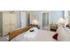 Elegant bedroom featuring soft tones, natural light, stylish furnishings, and access to a bathroom at 332 Clearpath Dr, Summerville, SC 29486