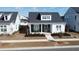 Charming home exterior with cozy front porch and manicured landscaping at 332 Clearpath Dr, Summerville, SC 29486