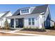 Charming home with a cozy porch and a combination of white and gray siding, offering classic curb appeal at 332 Clearpath Dr, Summerville, SC 29486