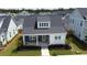 Charming single-Gathering home featuring a welcoming front porch and well-maintained landscaping at 332 Clearpath Dr, Summerville, SC 29486