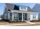 Charming home featuring a welcoming front porch, stylish decor, and meticulously landscaped front yard at 332 Clearpath Dr, Summerville, SC 29486