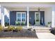 Inviting front porch with comfortable seating, decorative accents, and a welcoming entrance at 332 Clearpath Dr, Summerville, SC 29486
