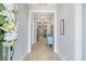 Elegant hallway with light wood floors, neutral walls, decorative lighting, and stylish furnishings at 332 Clearpath Dr, Summerville, SC 29486