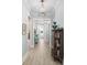 Inviting hallway featuring wood floors, decorative accents, and a view of the home's interior at 332 Clearpath Dr, Summerville, SC 29486