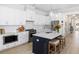 Modern kitchen with stainless steel appliances, white cabinets, stylish island, and hardwood floors at 332 Clearpath Dr, Summerville, SC 29486