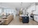 Open-concept living space with a kitchen featuring an island, modern appliances, and dining area at 332 Clearpath Dr, Summerville, SC 29486
