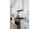 Modern kitchen features white cabinets, quartz countertops, and stainless steel appliances at 332 Clearpath Dr, Summerville, SC 29486