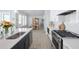 Modern kitchen features white cabinets, quartz countertops, and stainless steel appliances at 332 Clearpath Dr, Summerville, SC 29486