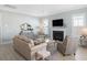 Cozy living room with a fireplace, comfortable seating, and stylish decor at 332 Clearpath Dr, Summerville, SC 29486