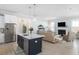 Open-concept living room with hardwood floors, fireplace, and stainless steel refrigerator at 332 Clearpath Dr, Summerville, SC 29486